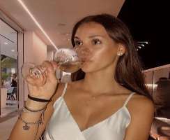 Arianna Martini consuming alcohol